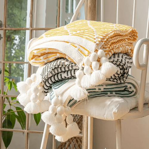 plaid décoratif à pompon empiler et plier
