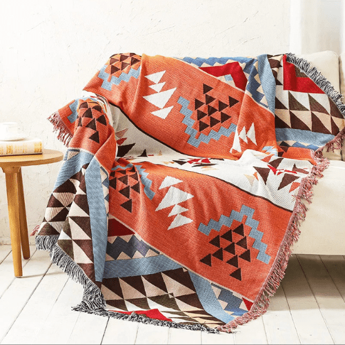 plaid nordique moderne orange placer sur un canapé blanc