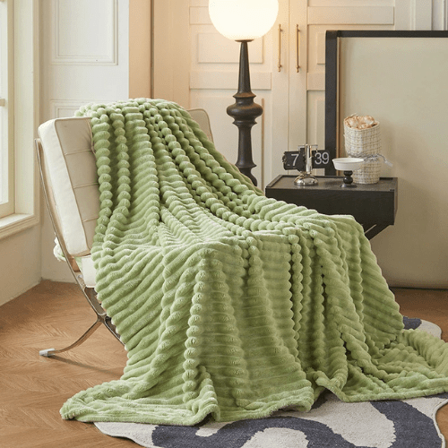 plaid skincover vert sur une chaise