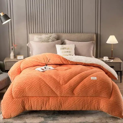 couverture lourde large orange placer sur un lit