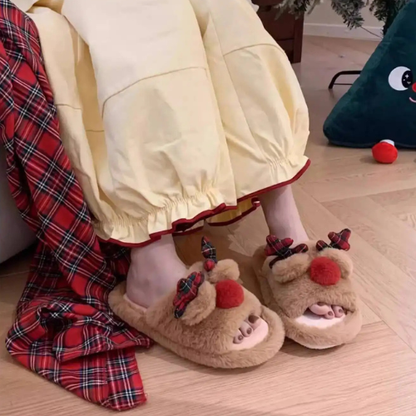 fille portant les pantoufle noel reine 