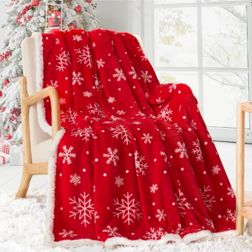 plaid de noël rouge flocon de neige sur une chaise