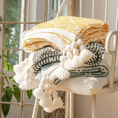plaid décoratif à pompon empiler et plier